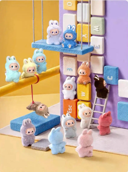 Labubu Pin For Love collectible plush keychains displayed with colorful blocks and characters by Kasing Lung.