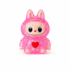 Squishy personnage rose pailleté kawaii anti-stress, ultra mignon, doux et moelleux.